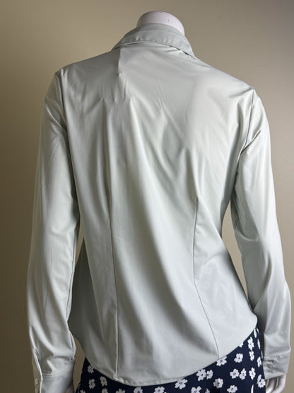 Back view of 7DIAMONDS Luxe blouse with curved hem