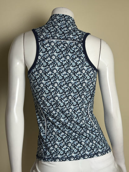 Back view of 1764 Signature sleeveless floral polo with contrasting seam details