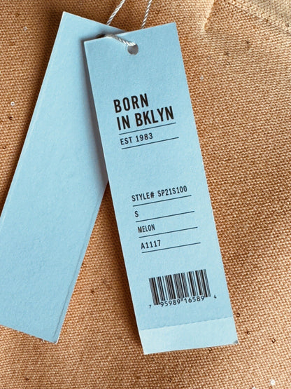 Attached Born in Bklyn tag showing size S and Melon color