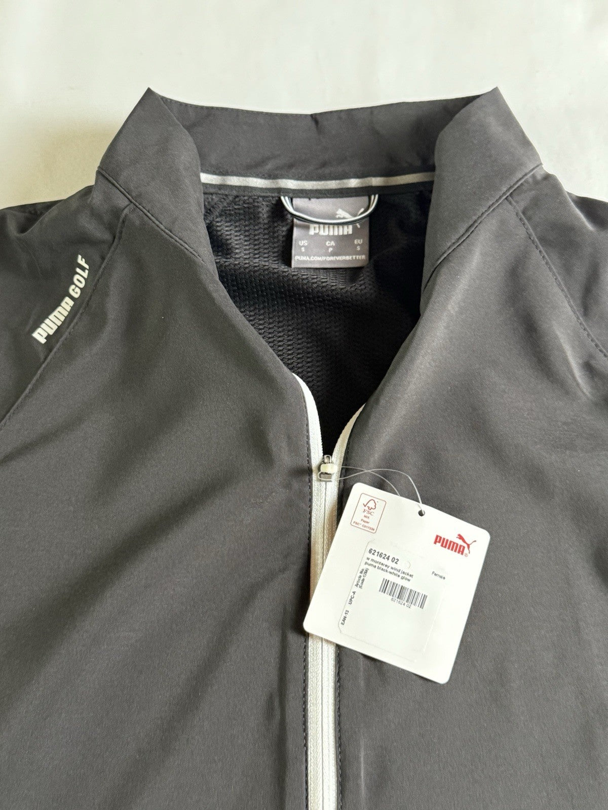 PUMA Women's White with Black Jacket Pockets Sz S.       (B.150/1)