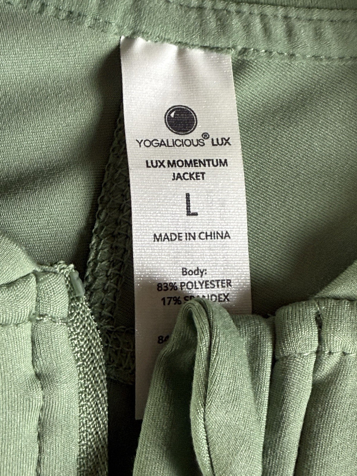 $88 Yogalicious women’s full zip performance jacket  size L. (B.194)