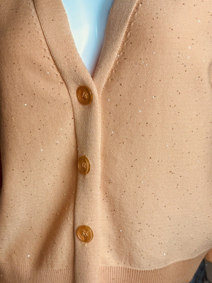Close view of Melon cardigan button front and decorative accents
