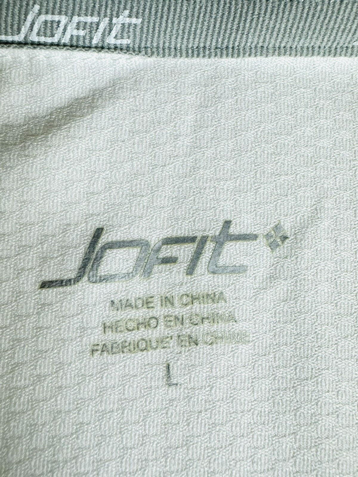 JOFIT WOMEN'S WHITE SCALLOPED V NECK GOLF SHIRT SZ L.  (48)